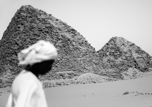 Sudan, Nubia, Nuri, sudanese man in front of the royal pyramids of napata