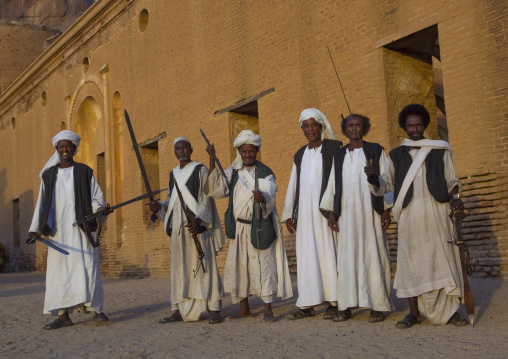 Sudan, Kassala State, Kassala, beja tribe men dancing in front of the khatmiyah mosque at the base of the taka mountains