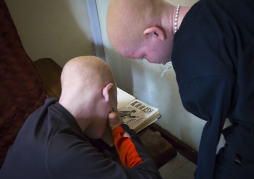 Tanzania, East Africa, Dar es Salaam, emmanuel festo a boy with albinism at under the same sun house, his left arm
was hacked off above the elbow, he lost fingers on the right hand and his to