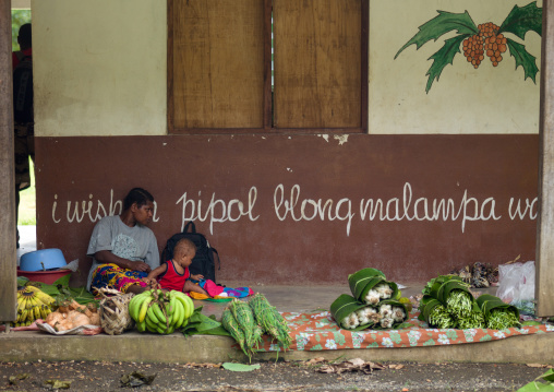Mother and child selling fruits and vegetables in the market, Efate island, Port Vila, Vanuatu