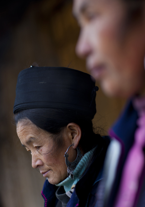 Black hmong woman with traditional hat and earrings, Sapa, Vietnam
