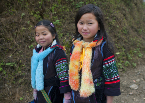 Black hmong girls wearing traditional scarves, Sapa, Vietnam