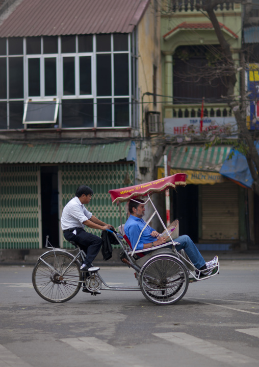 Men on a rickshaw in hanoi, Vietnam