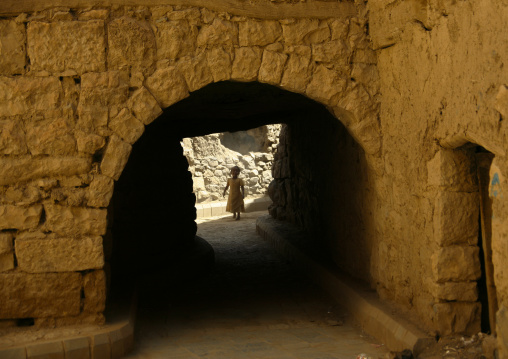Girl Standing At The Opposite End Of  Covered Street Passage, Amran, Yemen