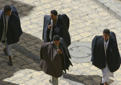 Clothes Sellers Passing By With All Their Stock In The Souq, Sanaa, Yemen