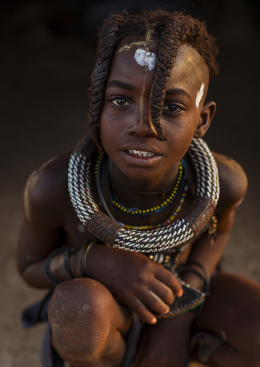 Young Himba tribe girl with traditional hairstyle, Kunene region, Epupa, Namibia