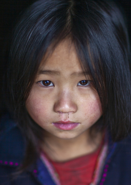 Cute young black Hmong girl in traditional clothes, Lao Cai province, Sapa, Vietnam
