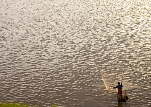 Fisherman with na net on Mekong river, Khammouane province, Thakhek, Laos
