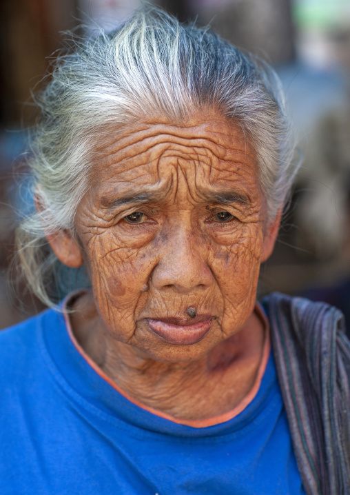 Old javanese woman with white hair, Java island, Yogyakarta, Indonesia