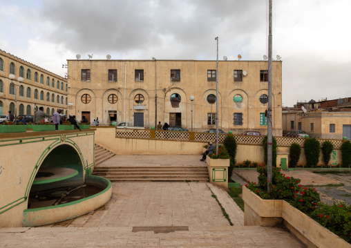 Exterior of old novecento style building and a fountain from the italian colonial times, Central region, Asmara, Eritrea