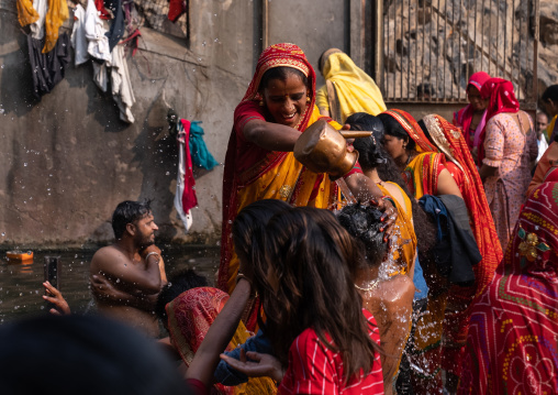 Indian pilgrims having a bath in Galtaji temple aka monkey temple, Rajasthan, Jaipur, India