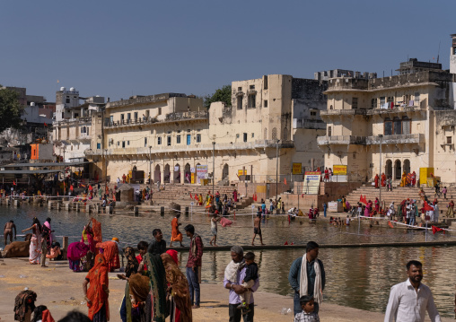 Indian pilgrims in Barhama lake and bathing ghats, Rajasthan, Pushkar, India