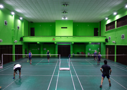 Men playing badminton in a former theatre inside model senior secondary school, Punjab State, Chandigarh, India