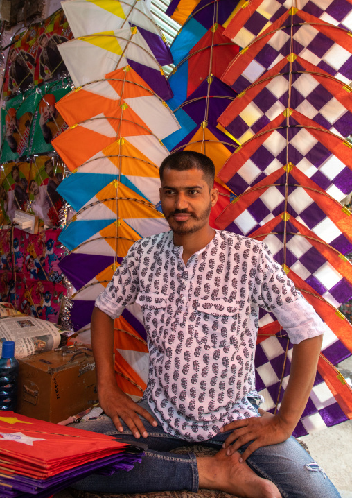 Indian seller in a kite shop in old Delhi, Delhi, New Delhi, India