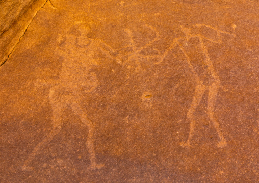 Petroglyphs on a rock depicting men fighting, Najran Province, Thar, Saudi Arabia