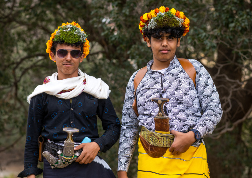 Portrait of flower men wearing floral crowns on the head, Asir province, Sarat Abidah, Saudi Arabia