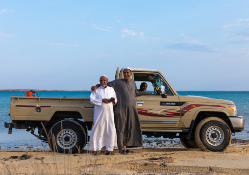 Saudi friends with their car in front of the sea, Jazan Province, Farasan, Saudi Arabia