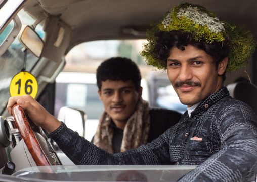 Portrait of a flower man in his car wearing a floral crown on the head, Jazan province, Addayer, Saudi Arabia