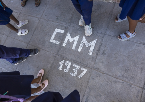 Children in front of 1937 CMM written on the floor, Nampula Province, Island of Mozambique, Mozambique