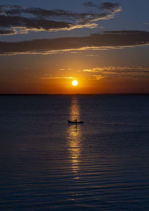 Fisherman in a canoe in the sunset, Nampula Province, Island of Mozambique, Mozambique