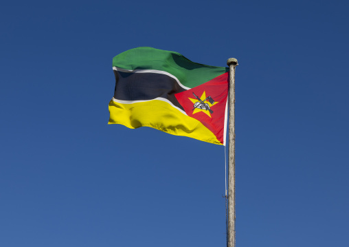 National flag against blue sky, Inhambane Province, Zavala, Mozambique