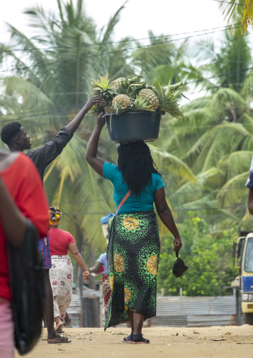 Woman carrying Pineapples on her head, Inhambane Province, Vilankulo, Mozambique
