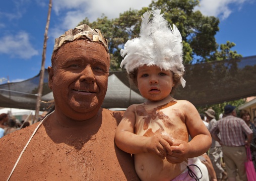 Father and kid during tapati festival, Easter Island, Hanga Roa, Chile