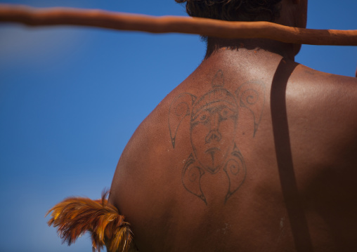 Back of a native man during spear competition at Tapati festival, Easter Island, Hanga Roa, Chile