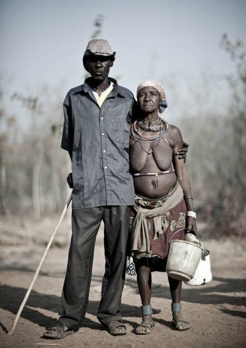 Old Mudimba Couple With The Woman Dressed In Traditional Way And The Man In The Western Way, Village Of Combelo, Angola