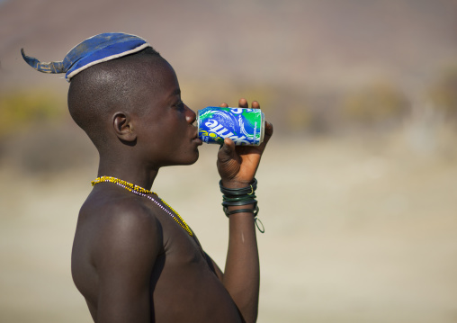 Muhimba Young Man With Traditional Hairstyle Drinkin A Sprite Can, Iona Village, Angola