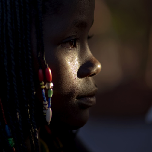 Mucawana Girl With Beaded Hairstyle In The Dark, Village Of Oncocua, Angola