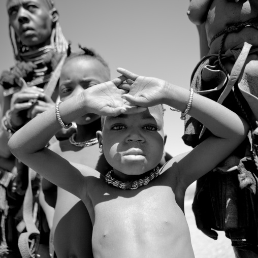 Muhimba Kid Protecting From The Sun With His Hands, Village Of Elola, Angola