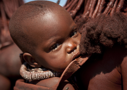 Muhimba Baby On His Mother Back, Village Of Elola, Angola