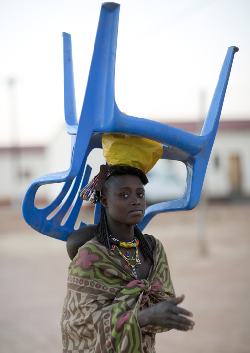 Woman Carrying A Chair On Her Head, Village Of Oncocua, Angola