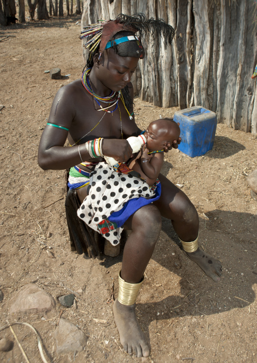 Mucawana Woman Feeding Her Baby With Baby S Bottle, Village Of Soba, Angola