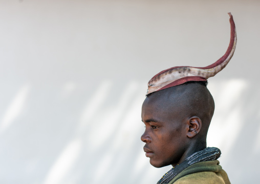 Side view of a single Himba tribe young man, Cunene Province, Oncocua, Angola