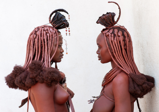 Himba tribe women face to face, Cunene Province, Oncocua, Angola