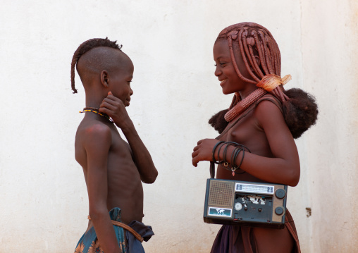 Himba tribe children with an audio tape recorder, Cunene Province, Oncocua, Angola