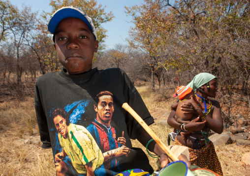 Mudimba tribe boy wearing a ronaldino shirt, Cunene Province, Kuroca, Angola