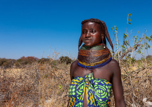 Portrait of a Mumuhuila tribe woman portrait wearing a huge necklace, Huila Province, Chibia, Angola