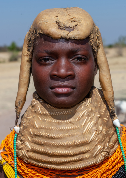 Portrait of a Mumuhuila tribe woman portrait wearing a huge necklace, Huila Province, Chibia, Angola