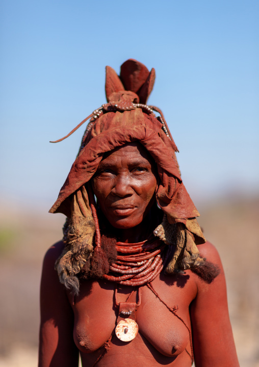 Himba tribe woman with a headwear made with goat skin, Cunene Province, Oncocua, Angola