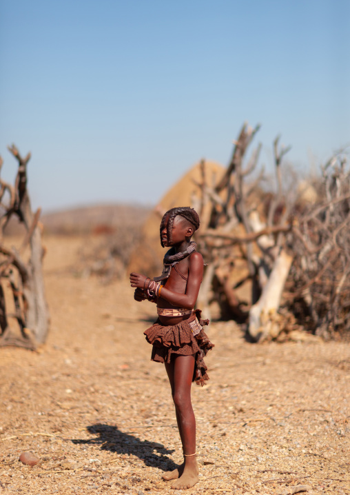 Himba tribe girl in her village, Cunene Province, Oncocua, Angola