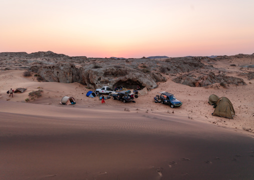 Tourists camping in the pink sands, Namibe Province, Iona National Park, Angola