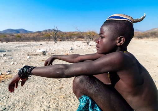 Portrait of a single Himba tribe young man, Cunene Province, Oncocua, Angola