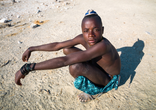 High angle view of a Himba tribe young man, Cunene Province, Oncocua, Angola