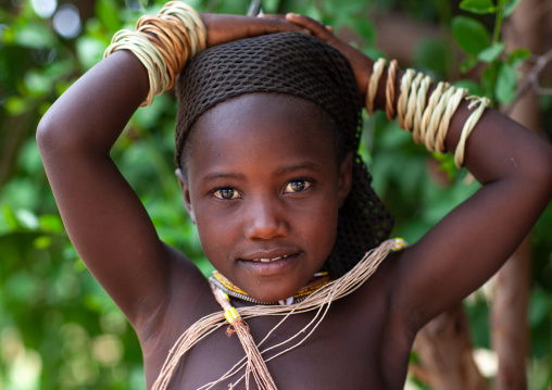 Portrait of a Mucubal tribe girl wearing wooden bracelets, Namibe Province, Virei, Angola