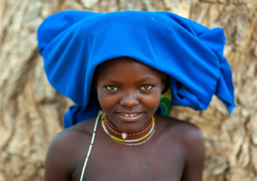 Mucubal tribe young woman wearing a blue headwear, Namibe Province, Virei, Angola
