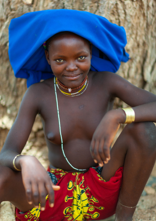 Mucubal tribe young woman wearing a blue headwear, Namibe Province, Virei, Angola