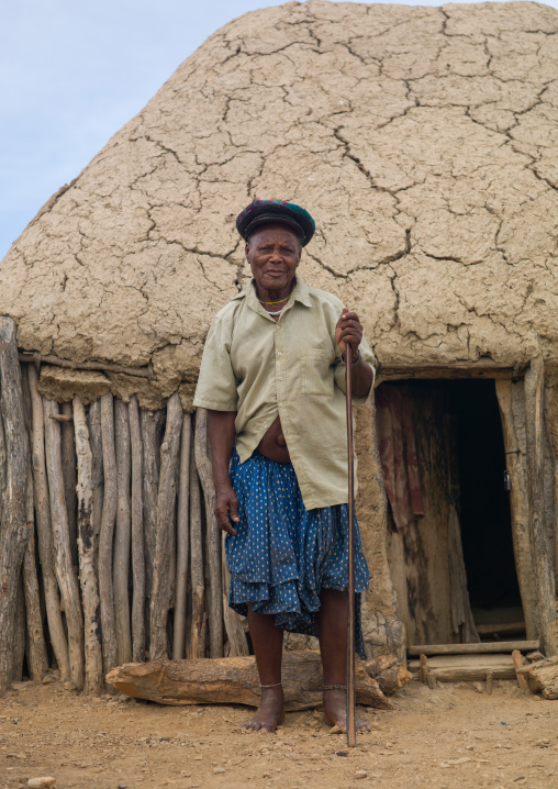 Traditional leader of the village called a Soba standing at the entrance of his hut, Namibe Province, Virei, Angola